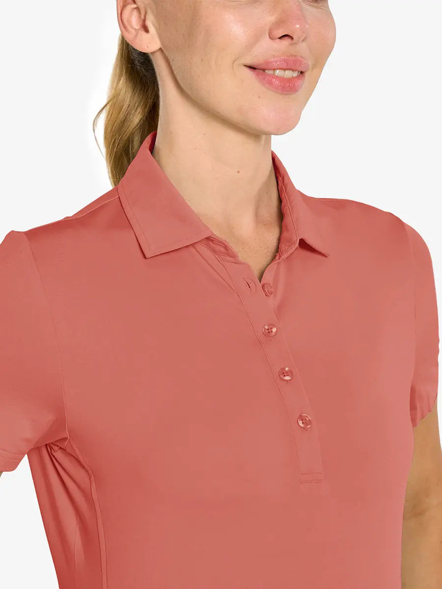 Close-up front view from nose to chest in CORAL PINK Women's Performance Solid Polo
