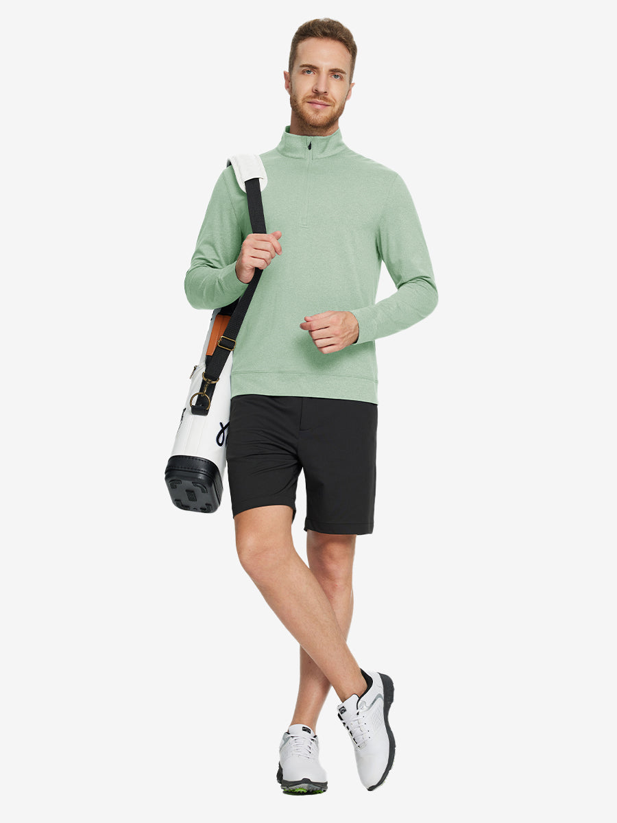 Full-body view of model carrying golf bag in quarter zip melange pullover beryl green melange.
