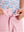 Detail: waistband of pink boys lightweight dry fit flat front golf shorts