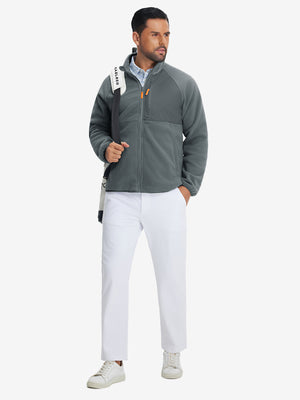 Full-body shot of the model wearing the reversible fleece jacket with 5 pockets in dark grey.