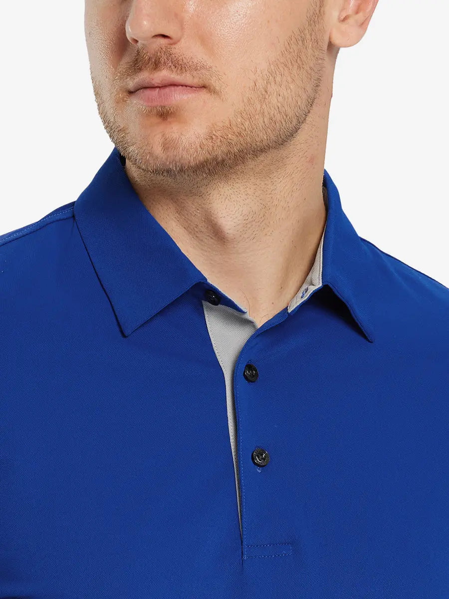Model front close-up from nose to chest wearing COBALT Ventilated Pique Performance Polo