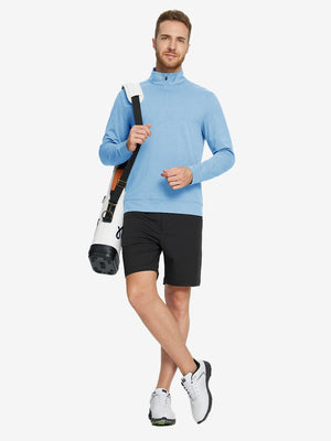 Model carrying a tennis bag, wearing light blue melange quarter zip melange pullover in full-body view.