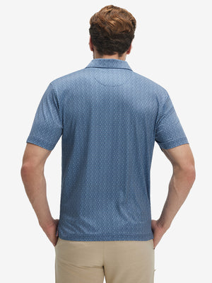 Back upper body view of model in Performance quick dry print golf polos with subtle light blue navy circles tone