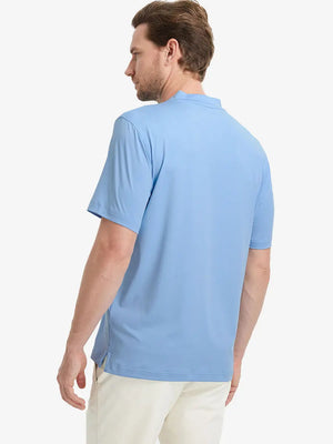 Back half-body view wearing Everyday Collarless Jersey Shirt in LIGHT BLUE.