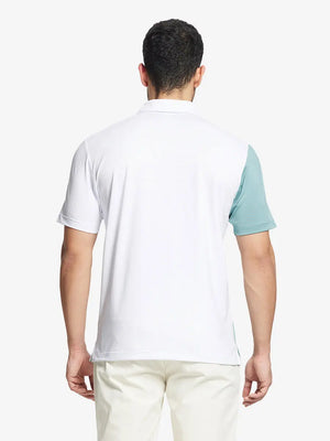 Back half-body view of model in WHITE Moisture Wicking Color Block Polo Shirt.