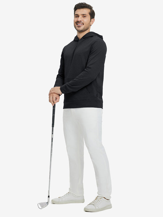 Model full-body view holding a golf club wearing warm fleece golf hoodies pullover in black.
