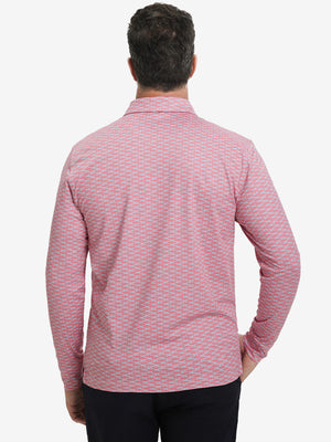 Back upper body view of the lightweight print polo in pink small fish, model turns slightly with relaxed pose.