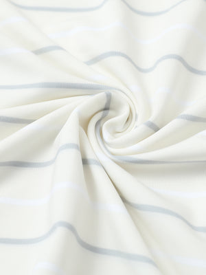 Fabric close-up of trendy boys stripe polo shirts, soft texture and breathable beige stripe feel