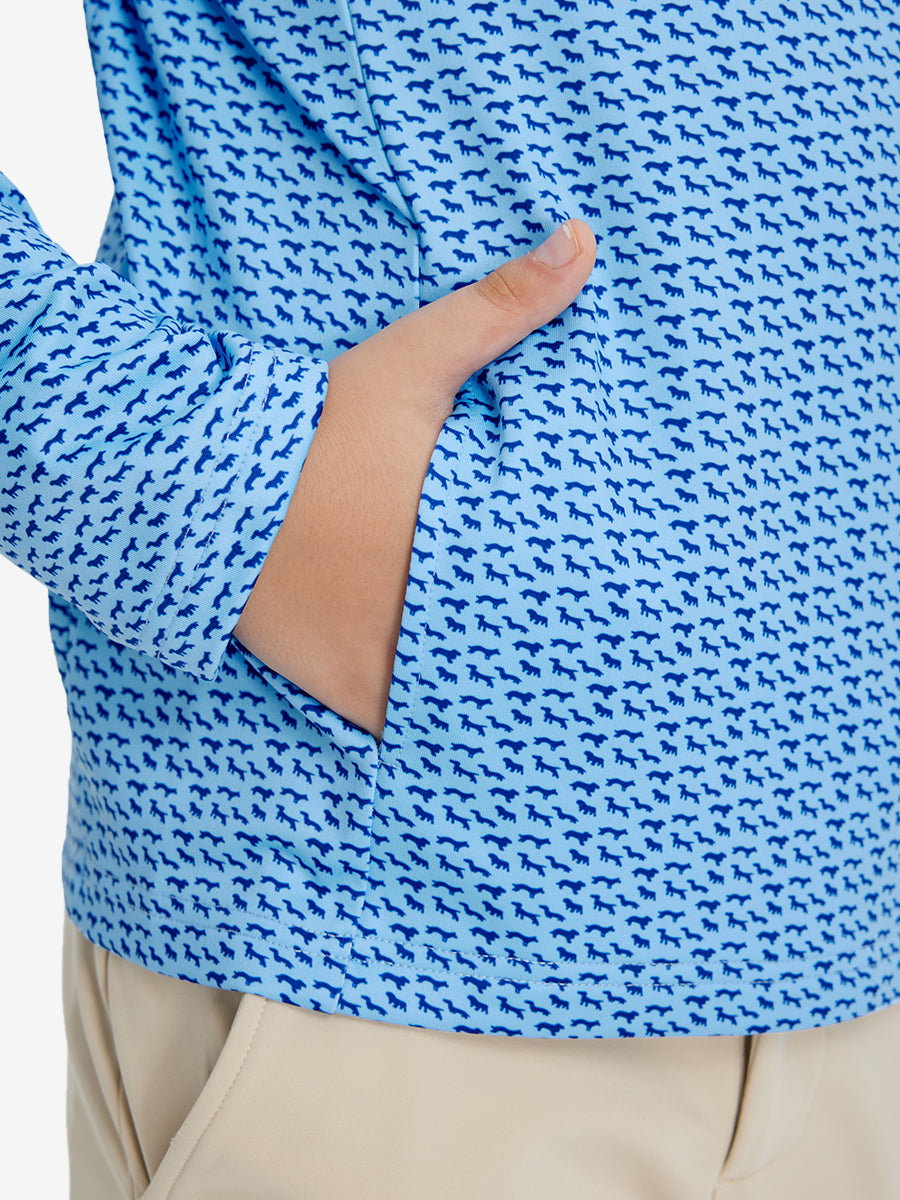 Model with both hands in pockets wearing youth full print stylish hoodies pullover in bluejay navy dogs.