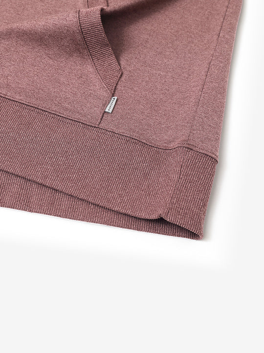 Hem detail of the Pink Heather Athletic Golf Hoodie, highlighting clean stitching and neat design.