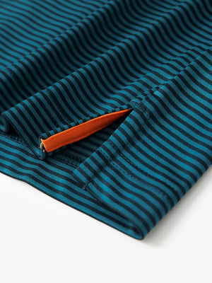 Detailed view of side hem slit on Cooling Stripe Golf Shirt in TURQUOISE STRIPE, showing comfort and design