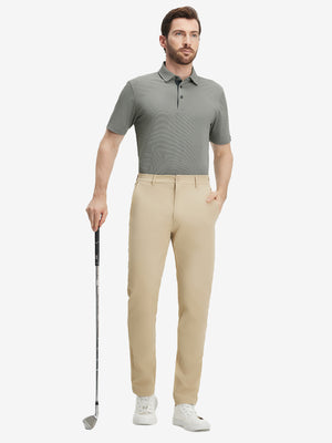 Full-body shot of a model holding a golf club, wearing the black feather weight jacquard polo shirts and pants