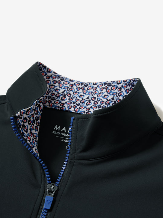 Collar zipper and inner neck pattern detail of the lightweight golf quarter zip pullover in dark grey.