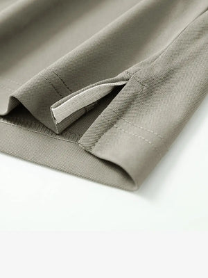 Detail shot of hem opening on DARK KHAKI Ventilated Pique Performance Polo