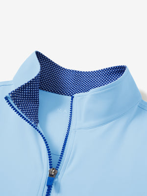 Collar zipper and inner neck pattern detail of the lightweight golf quarter zip pullover in light blue.