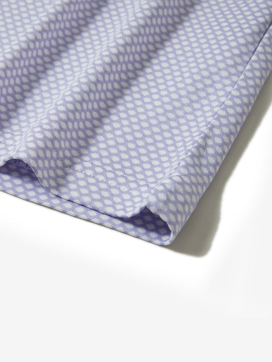 Hem detail of jacquard quarter zip pullover in lavender, focusing on stitching and side vent finish.