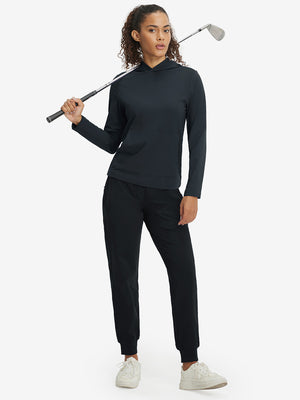 Model holding golf club, dressed in women's lightweight hoodies pullover in dark grey.