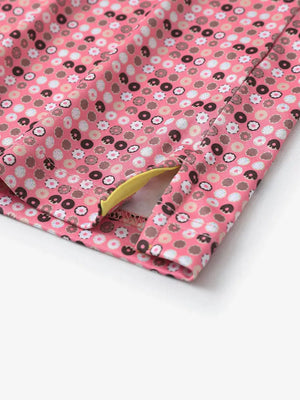 Close-up detail of side slit hem on PINK DONUT polo designed for comfort and movement