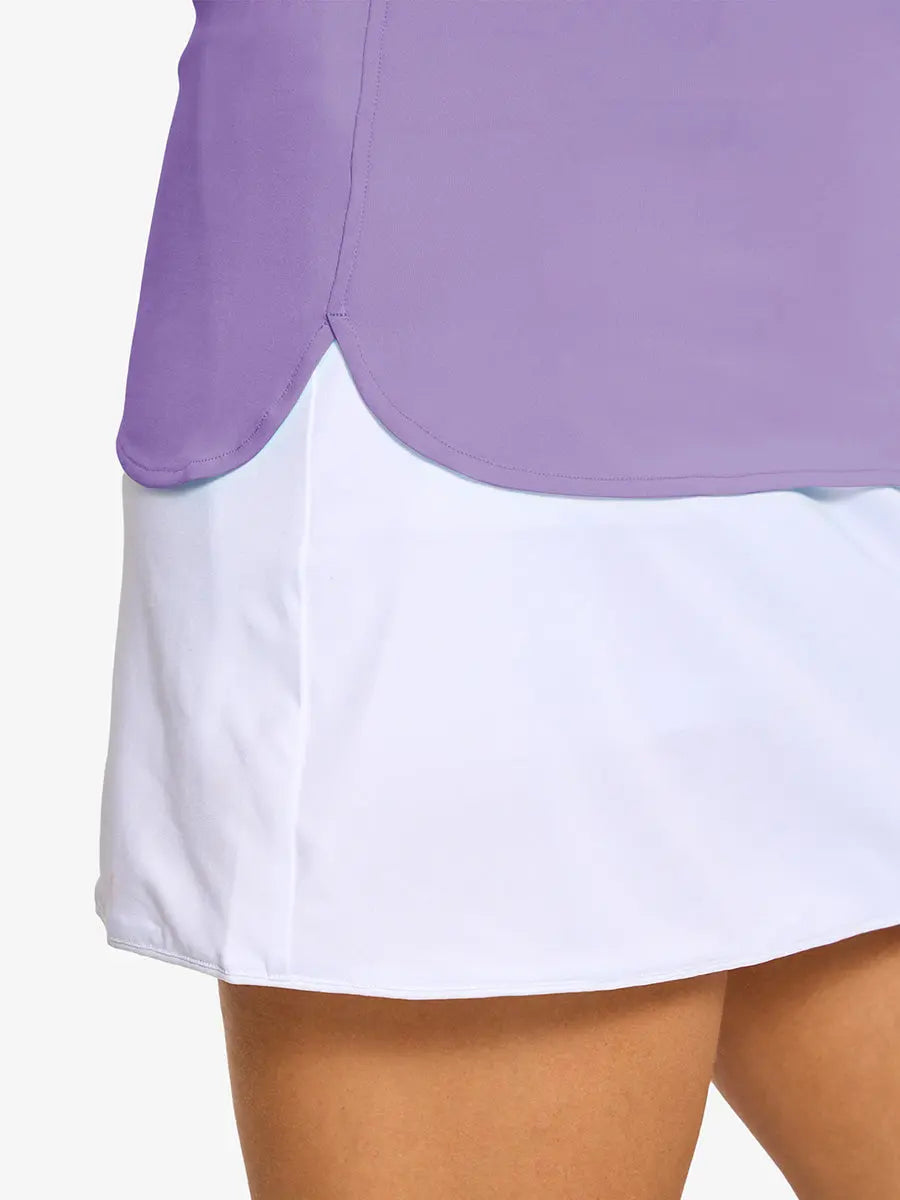 Detail shot of side hem opening on LILAC Women's Performance Solid Polo