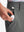 Detail: pocket of dark grey boys lightweight dry fit flat front golf shorts