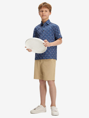 Full front: boy in american elements performance print boys golf polo holding sports gear.