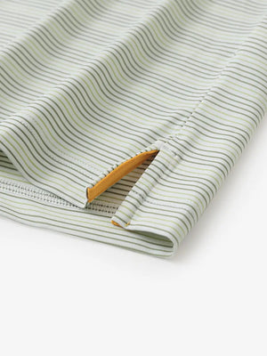 Close-up of side hem slit on Olive Green Grass Green Performance Stripe Golf Shirt