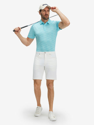 Full-body shot of model holding a golf club in misty blue ultra-light quick dry moisture wicking collared polo shirt