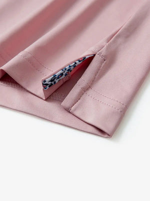 Close-up of side slit detail on the Pale Pink Everyday Classic Solid Polo hem