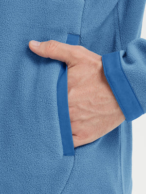 Hand in pocket detail of the Misty Blue Quarter Zip Polar Fleece Sweatshirt, soft fleece fabric.
