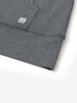 Hemline detail of the Quarter Zip Hoodie in Black Grey Heather, showing neat edges and fine craftsmanship.