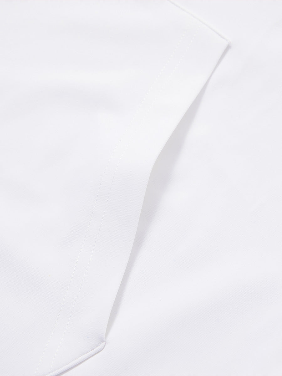 Close-up of single pocket detail on youth long sleeve hoodied with kangaroo pocket in white, showing stitching.