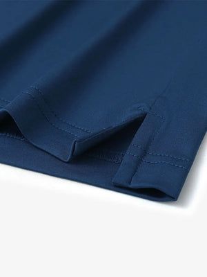 Close-up detail of hem slit on Everyday Solid Jersey Polo in BLUE, emphasizing quality stitching.