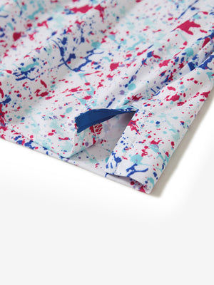 Hem slit detail of the white painting lightweight print long sleeve polo, showing fine stitching and finish.