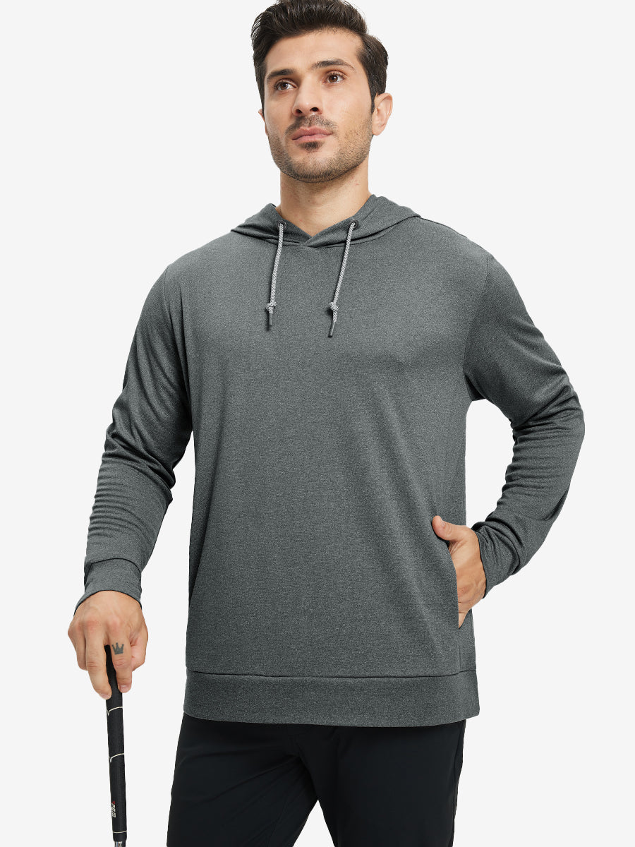 Model with one hand in pocket, wearing classic heather pullover hoodie in black melange, relaxed look.