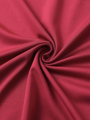 Close-up of red chest print polo shirt fabric showing smooth texture and crisp graphic application area.