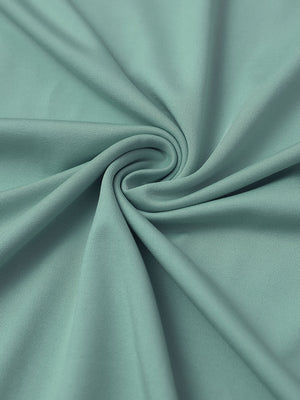 Close-up of fabric on everyday jersey henley shirt, soft knit texture with relaxed beryl green tone