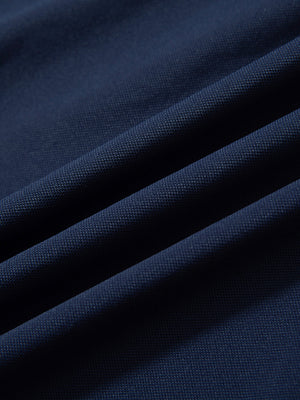 Fabric detail of Long sleeve performance solid pique polo with breathable knit in navy