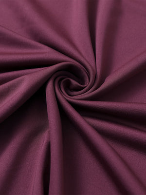 Close-up of bordeaux red everyday classic solid polo fabric texture.