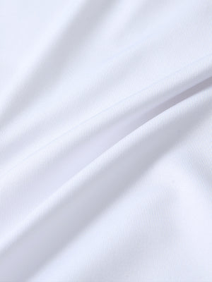 Close-up of white long sleeve solid jersey polo fabric texture showing soft knit and smooth finish details.