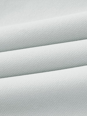 Close-up of wrinkle-resistant, sun-protective fabric on water-resistant golf stretch nylon pants in glacier grey.