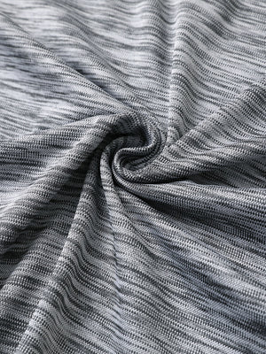 Close-up of black grey heather texture polo fabric showing soft surface.