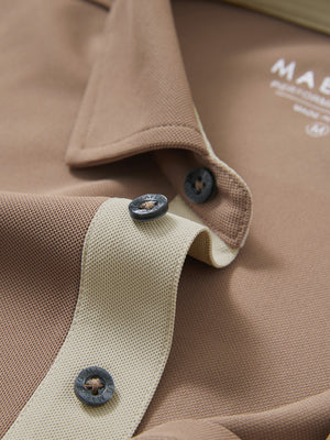 Detail shot of the collar on the light brown ventilated pique performance polo, emphasizing the classic neckline design