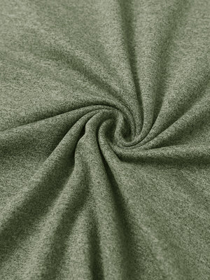 Close-up of fabric on men's long sleeve mock turtleneck shirt, soft knit texture with subtle stretch in olive green heather