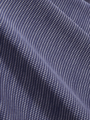 Close-up texture of light dark blue grid featherweight midlayer quarter zip pullover fabric showing detailed lightweight material and weave.
