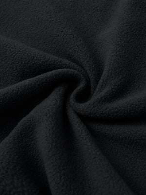 Fabric close-up of Polar fleece q-zip hooded with 3 pockets showing soft texture in black