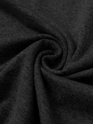 Close-up fabric detail of skin-friendly long sleeve melange polo, soft blend texture with black tone