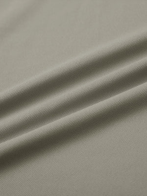 Fabric detail of Long sleeve performance solid pique polo with breathable knit in dark khaki