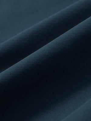 Macro view of the navy stretch soft flat front dress golf shorts fabric, showcasing the smooth texture