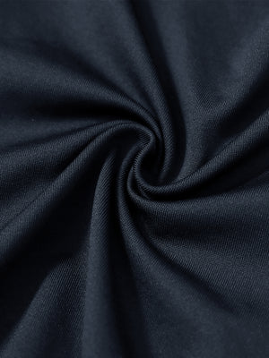 Close-up texture of  navy warm puffer winter golf jacket fabric showing detailed premium material and weave