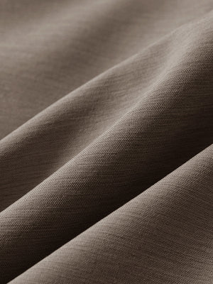 Close-up texture of tobacco brown flat front hybrid golf shorts fabric showing detailed hybrid material and weave.